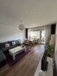 Wohnzimmer - Sonnige modernisierte 2 Zimmer Wohnung in NU-Offenhausen mit Münsterblick